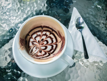 High angle view of cappuccino on table