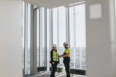 Workers talking at construction site