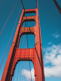 Low angle view of bridge against blue sky