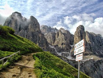 Scenic view of mountains against cloudy sky