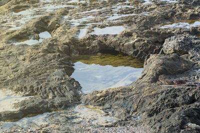 High angle view of rock formation on beach