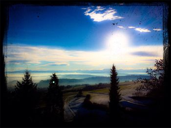 Scenic view of landscape against blue sky