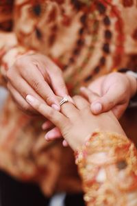 Close-up of woman holding hands