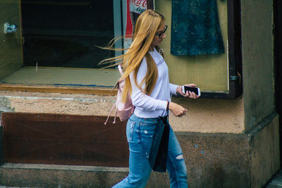 Woman standing by window