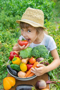 Portrait of cute boy eating fruit