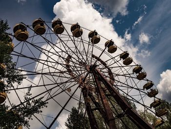 Low angle view of ferris wheel against sky