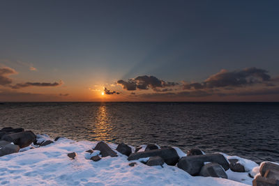 Scenic view of sea against sky during sunset