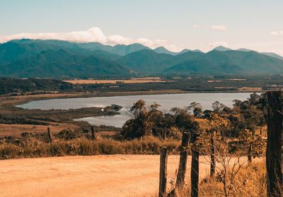 Scenic view of landscape and mountains against sky