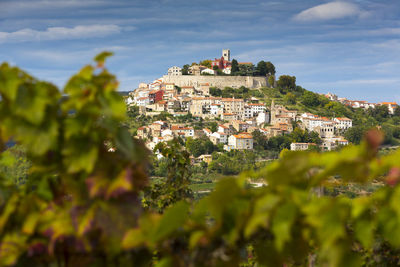 View of townscape against blue sky