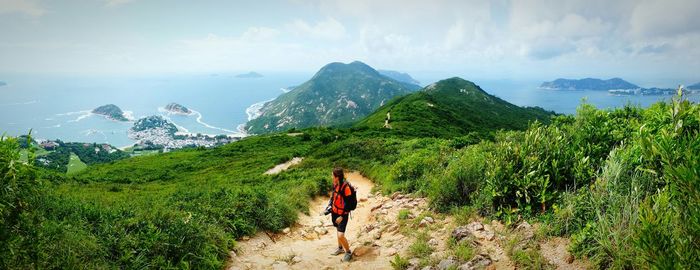 Scenic view of landscape against cloudy sky