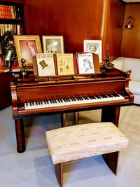 High angle view of piano and chairs at home