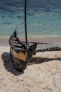 Boat moored on shore