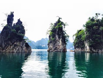 Scenic view of sea with rocks in background