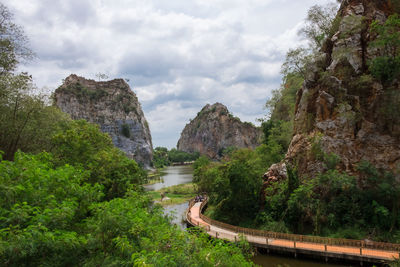 Panoramic view of road amidst trees against sky