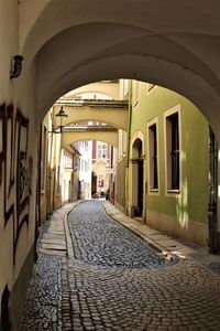 Empty corridor along buildings