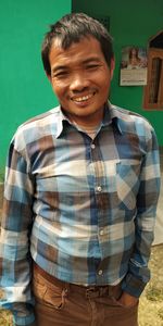 Portrait of young man standing outdoors