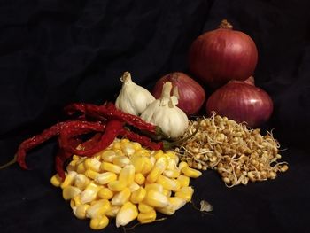 Close-up of bell peppers against black background