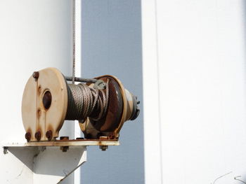 Close-up of fire hydrant against wall