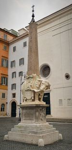 Low angle view of statue against building