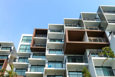 Low angle view of apartment building against clear sky