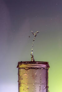 Close-up of water splashing on glass