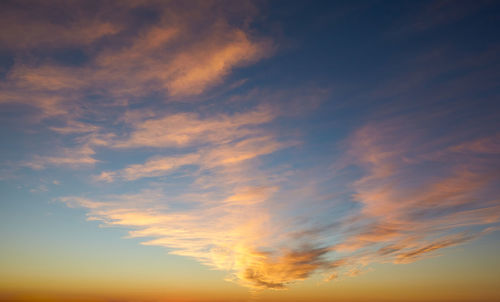 Low angle view of dramatic sky during sunset