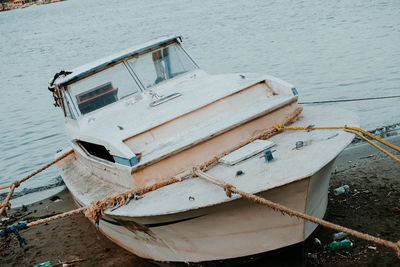 High angle view of fishing boat moored on beach