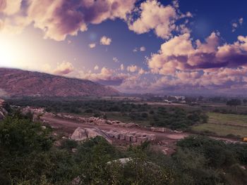 Aerial view of landscape against cloudy sky