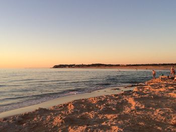 Scenic view of sea at sunset