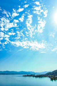 Scenic view of lake against blue sky