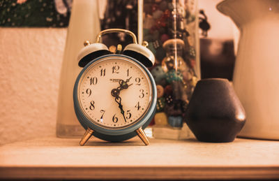 Close-up of alarm clock on table