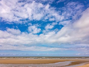 Scenic view of sea against blue sky