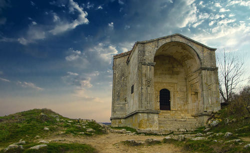 Low angle view of old building against sky