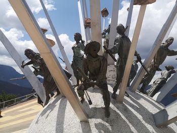 Low angle view of statue against sky