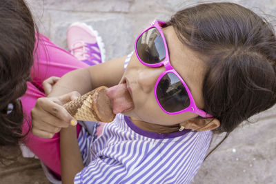 High angle view of girl eating ice cream