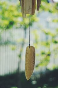 Close-up of wind chime hanging outdoors