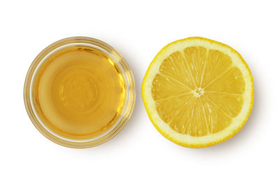 Directly above shot of lemon slice against white background