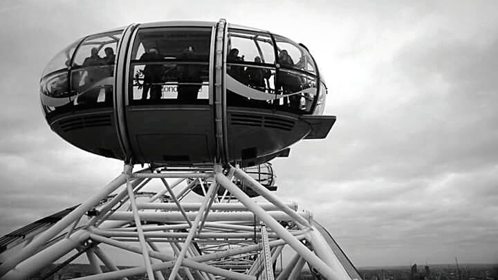 LOW ANGLE VIEW OF TOWER AGAINST CLOUDY SKY