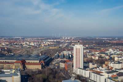 Cityscape against cloudy sky