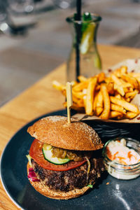 Close-up of hamburger served in plate on table