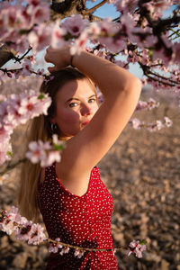 Portrait of woman with cherry blossom