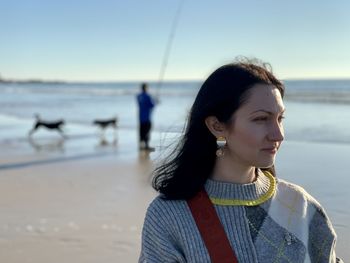 A young relaxed girl in porto by the ocean enjoying the moment