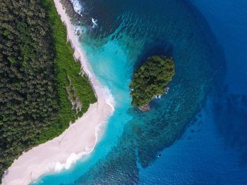 Aerial view of blue sea against sky