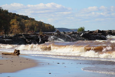 Scenic view of beach against sky