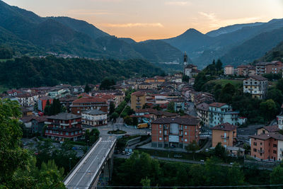 High angle view of townscape by mountain against sky in italy, zogno