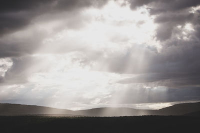 Scenic view of silhouette landscape against sky
