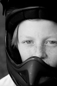 Close-up portrait of boy wearing helmet