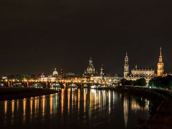 Illuminated city lit up at night