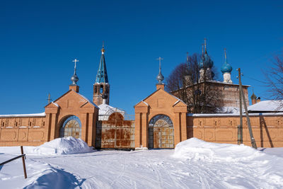 Building against clear blue sky during winter