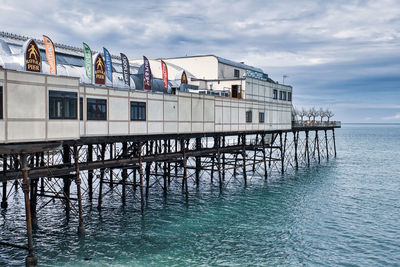 Pier over sea against sky